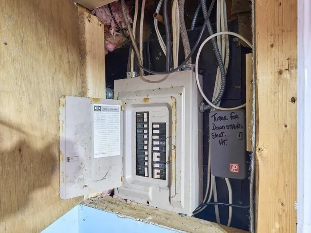 a bathroom with a granite countertop sink a mirror and shower