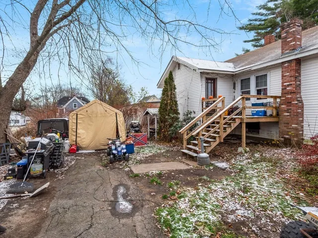 a view of a house with a backyard