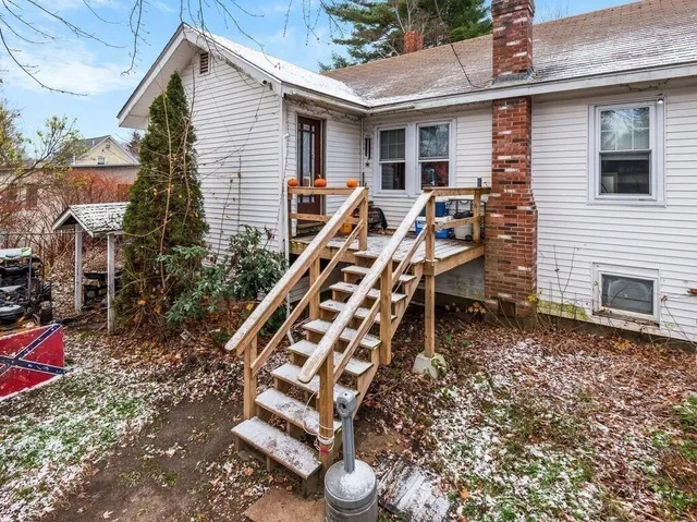 a view of a patio with table and chairs and potted plants