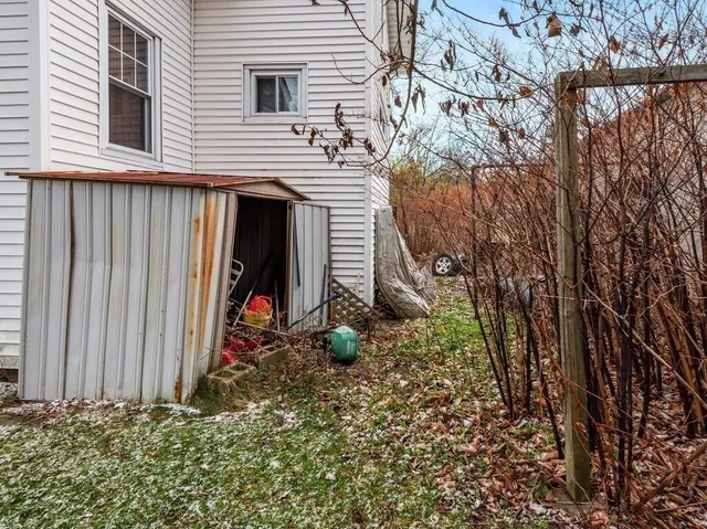 a view of a backyard of the house