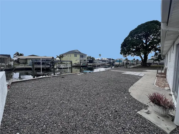 a view of a street with a cars parked in front of it