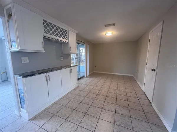 a view of a kitchen with a sink and cabinets