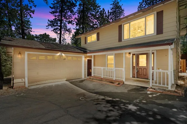 a front view of a house with a garage