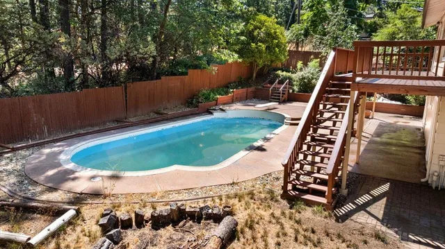 a view of a house with wooden deck
