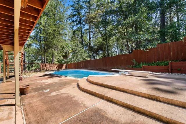 a view of balcony with wooden floor and fence