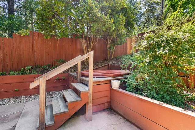 a view of a backyard with sitting area