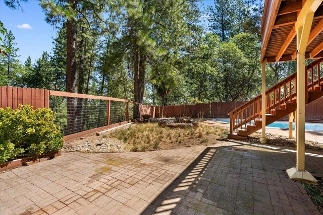 front view of a house with a yard and plants