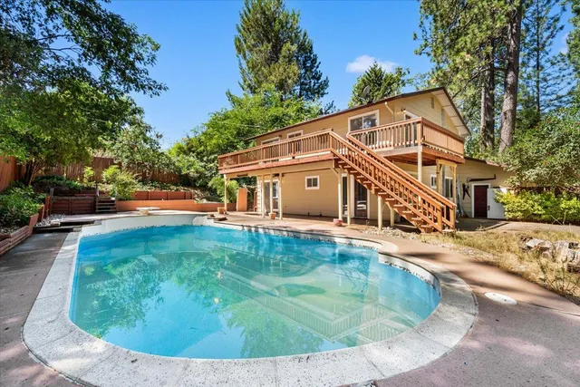 a view of a balcony with wooden floor