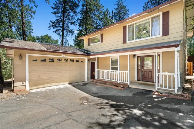 a view of a backyard with couches chair