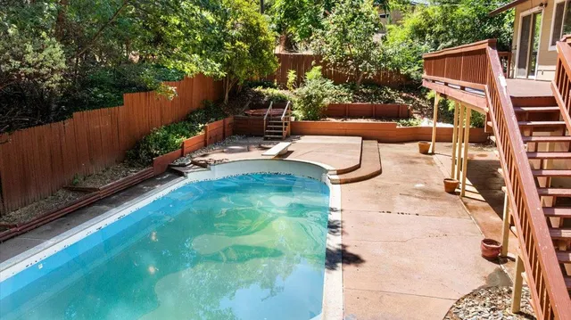 a backyard of a house with outdoor seating