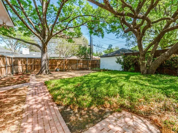 a view of a backyard with a garden