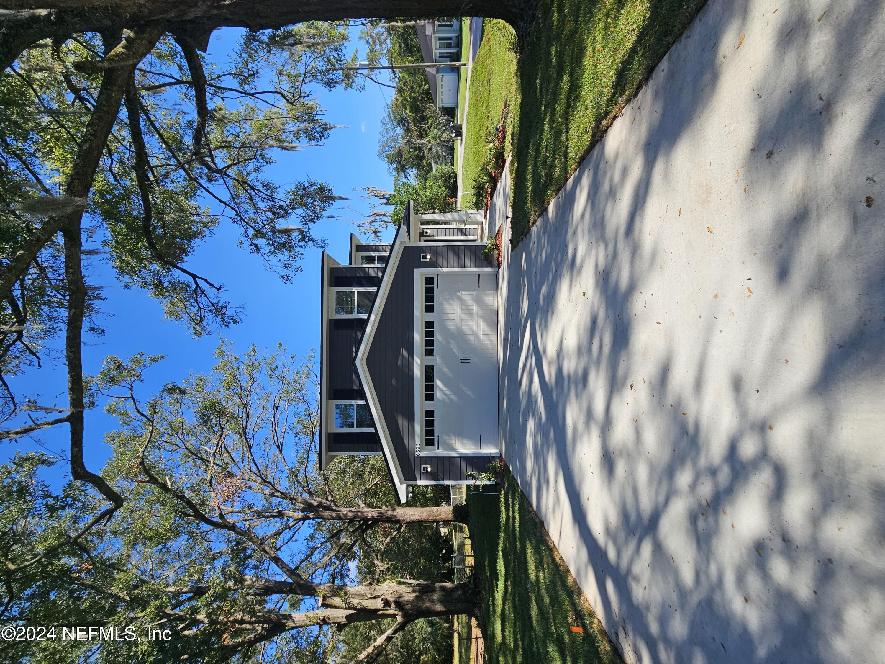6593 Ricker Road Jacksonville, FL 32244 - Photo 1 of 16 a view of a house with a yard