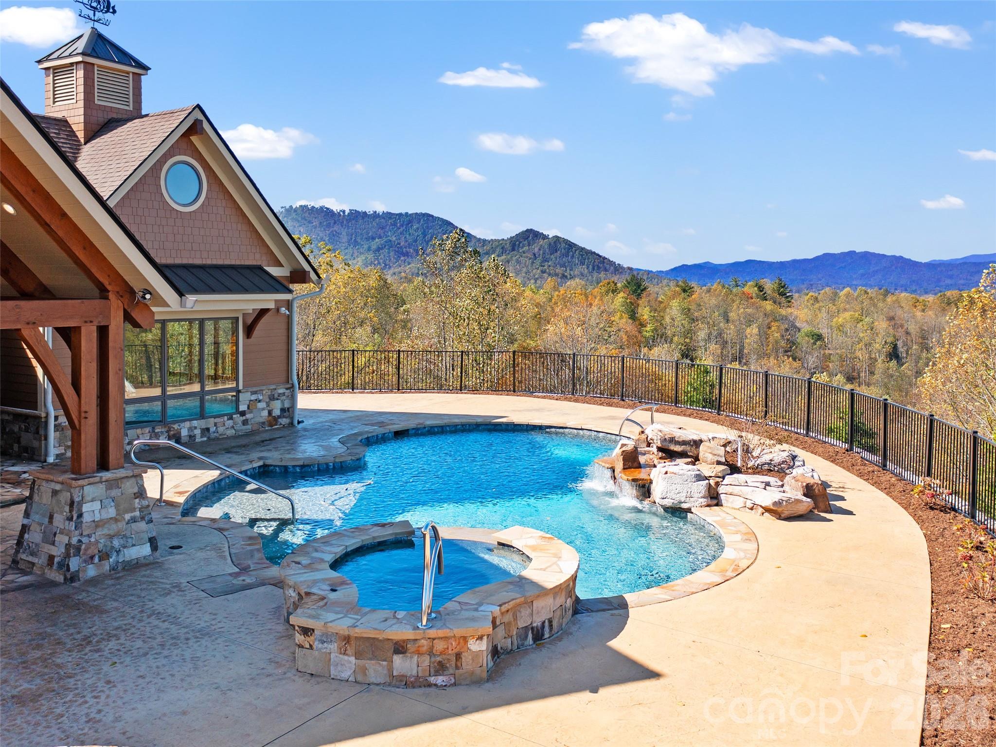 946 Ridge Road Green Mountain, NC 28740 - Photo 11 of 48 a view of a house with pool and chairs