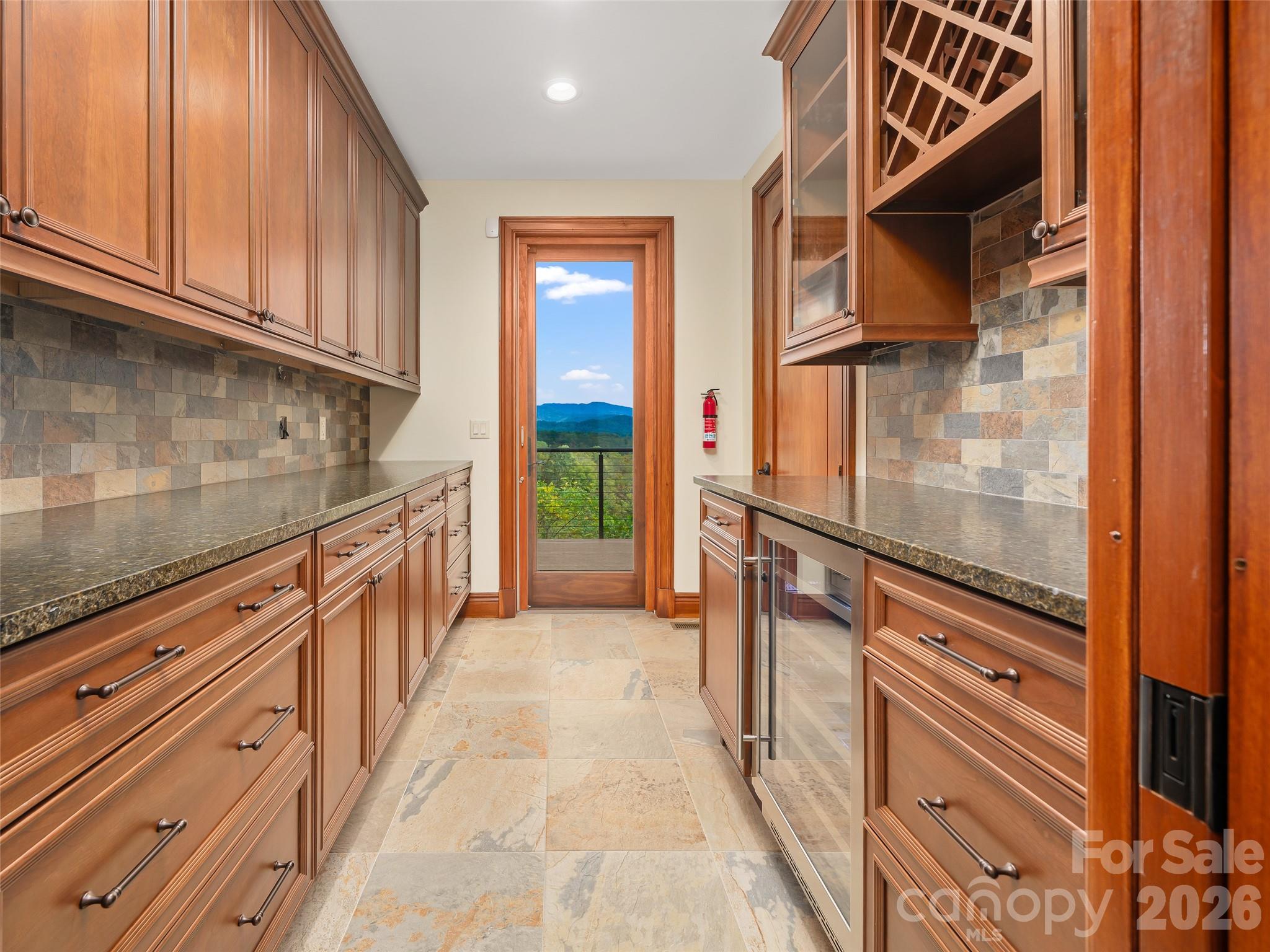 946 Ridge Road Green Mountain, NC 28740 - Photo 19 of 48 a view of a kitchen storage and utility room