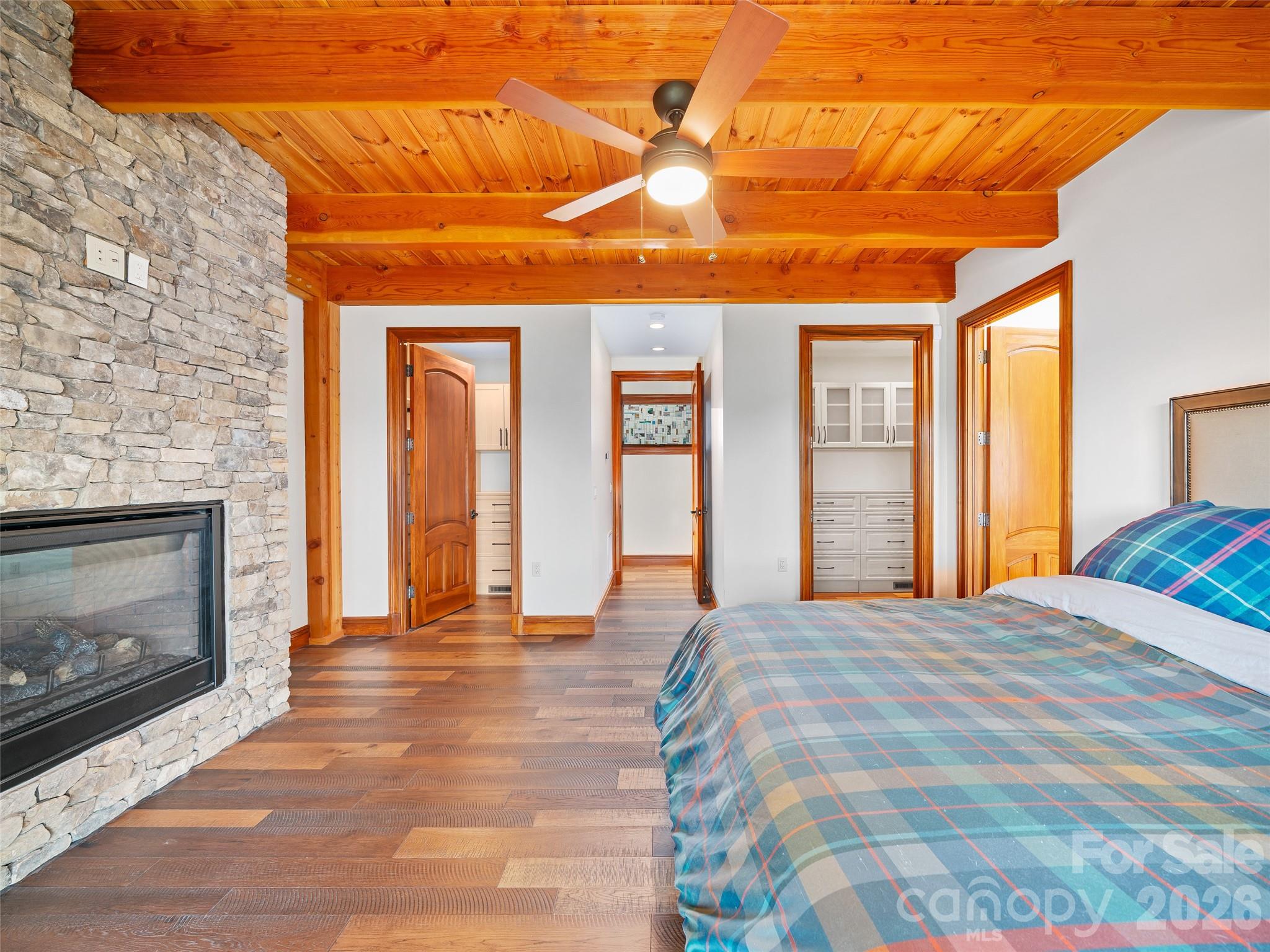 946 Ridge Road Green Mountain, NC 28740 - Photo 20 of 48 a view of a livingroom with wooden floor and a fireplace