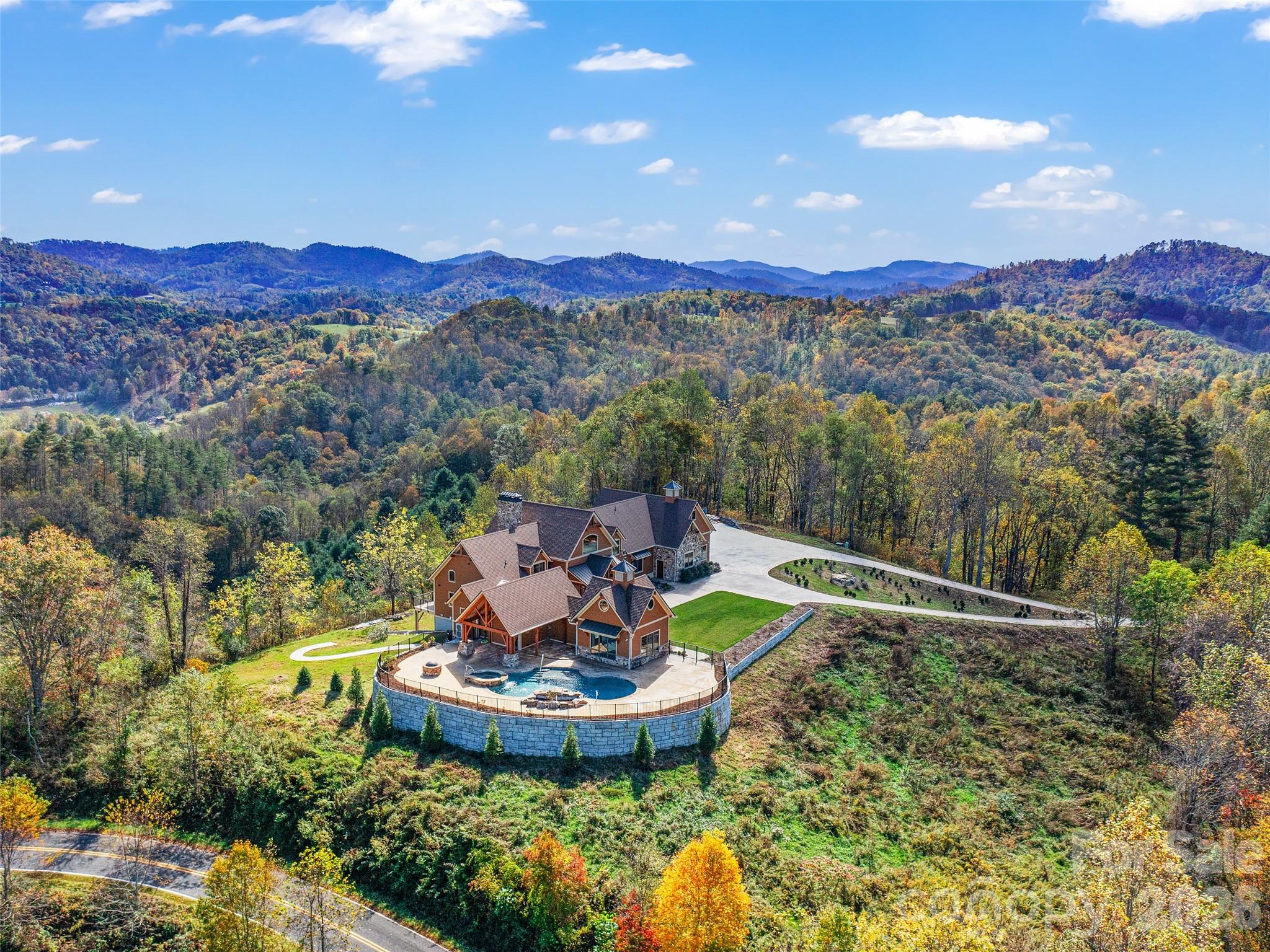 946 Ridge Road Green Mountain, NC 28740 - Photo 2 of 48 a view of a swimming pool with mountain view