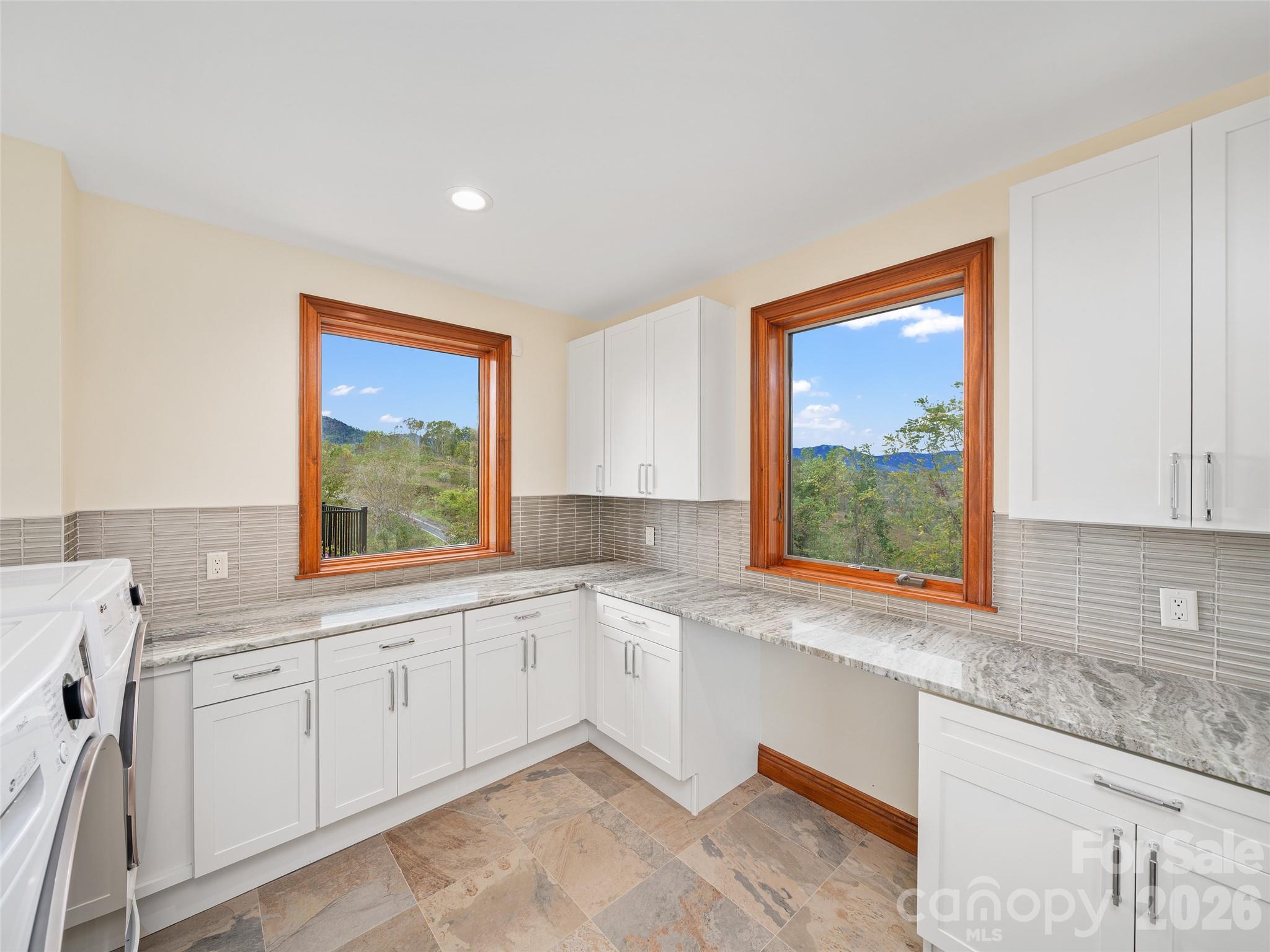 946 Ridge Road Green Mountain, NC 28740 - Photo 24 of 48 a kitchen with a sink window and cabinets