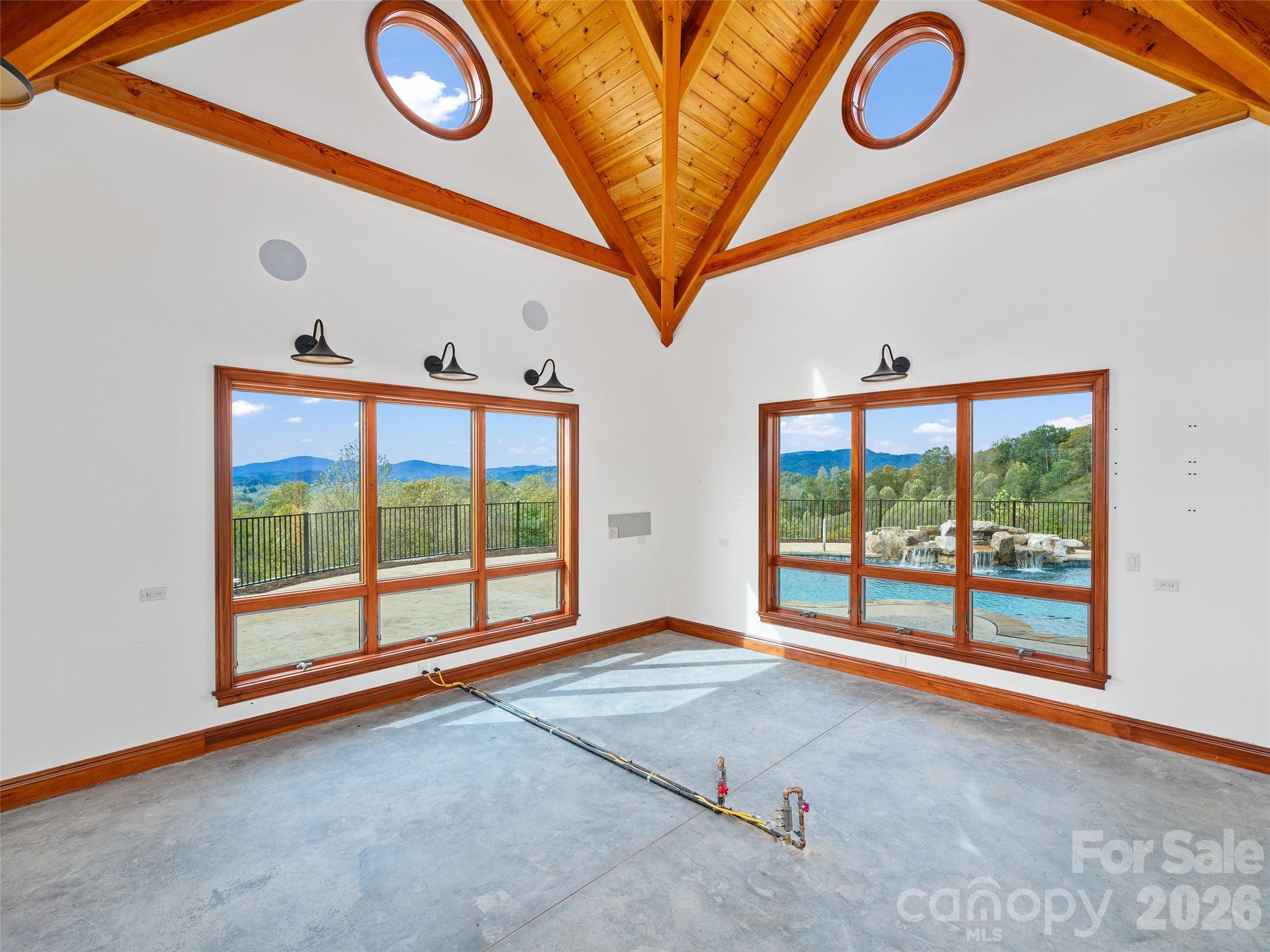 946 Ridge Road Green Mountain, NC 28740 - Photo 25 of 48 a view of an empty room with a floor to ceiling window