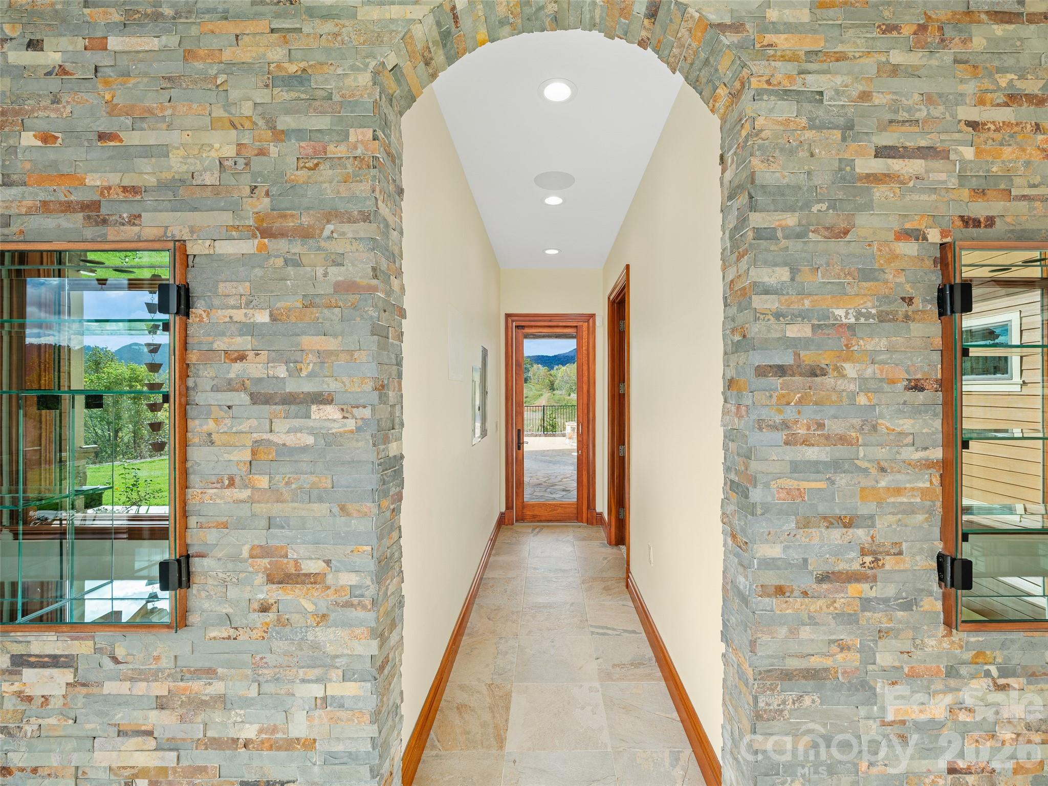 946 Ridge Road Green Mountain, NC 28740 - Photo 27 of 48 a view of a hallway with brick walls