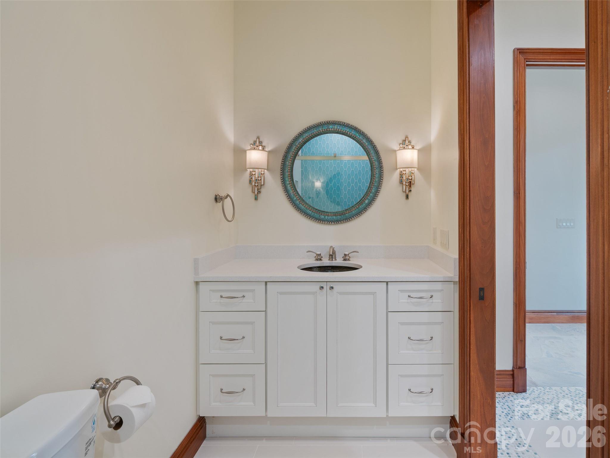 946 Ridge Road Green Mountain, NC 28740 - Photo 29 of 48 a bathroom with a sink and a mirror