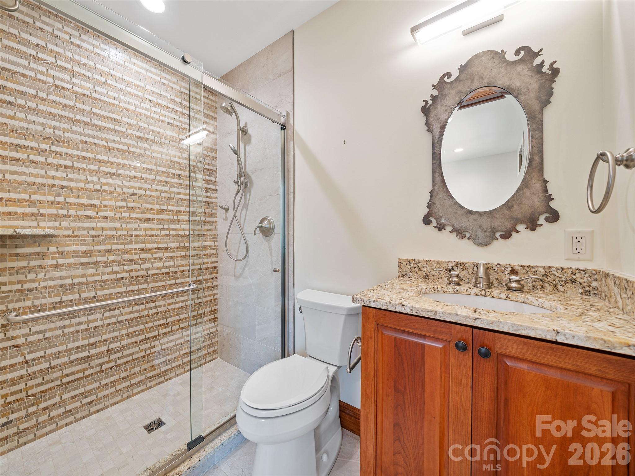 946 Ridge Road Green Mountain, NC 28740 - Photo 30 of 48 a bathroom with a sink toilet and shower