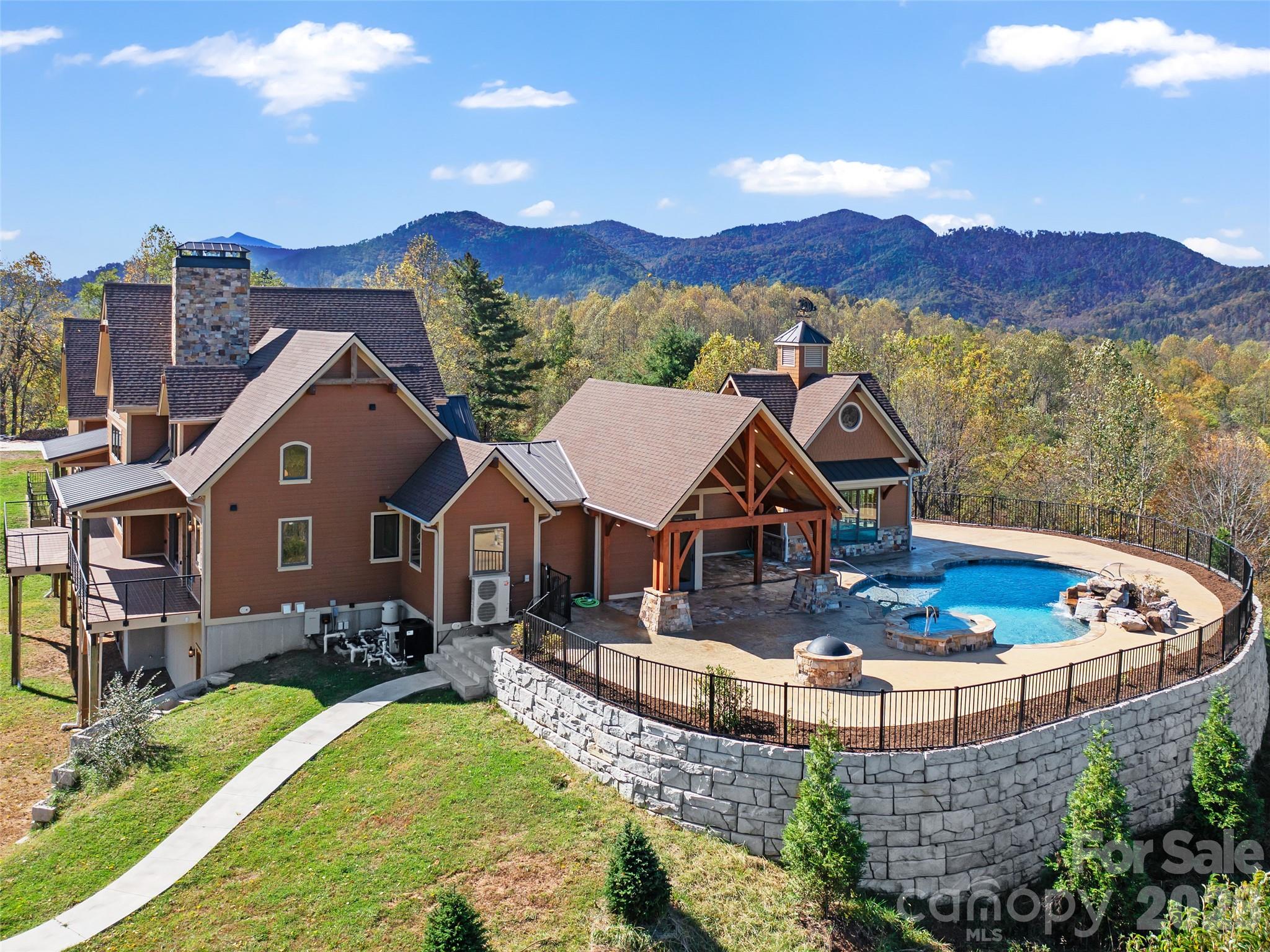 946 Ridge Road Green Mountain, NC 28740 - Photo 3 of 48 a view of a house with outdoor space and a tub