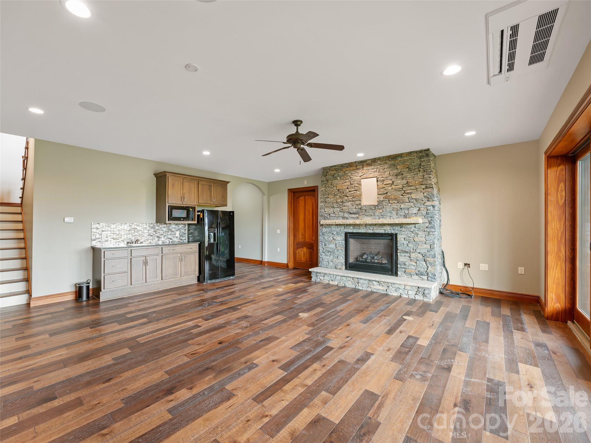 946 Ridge Road Green Mountain, NC 28740 - Photo 41 of 48 a view of an empty room with a fireplace and a window