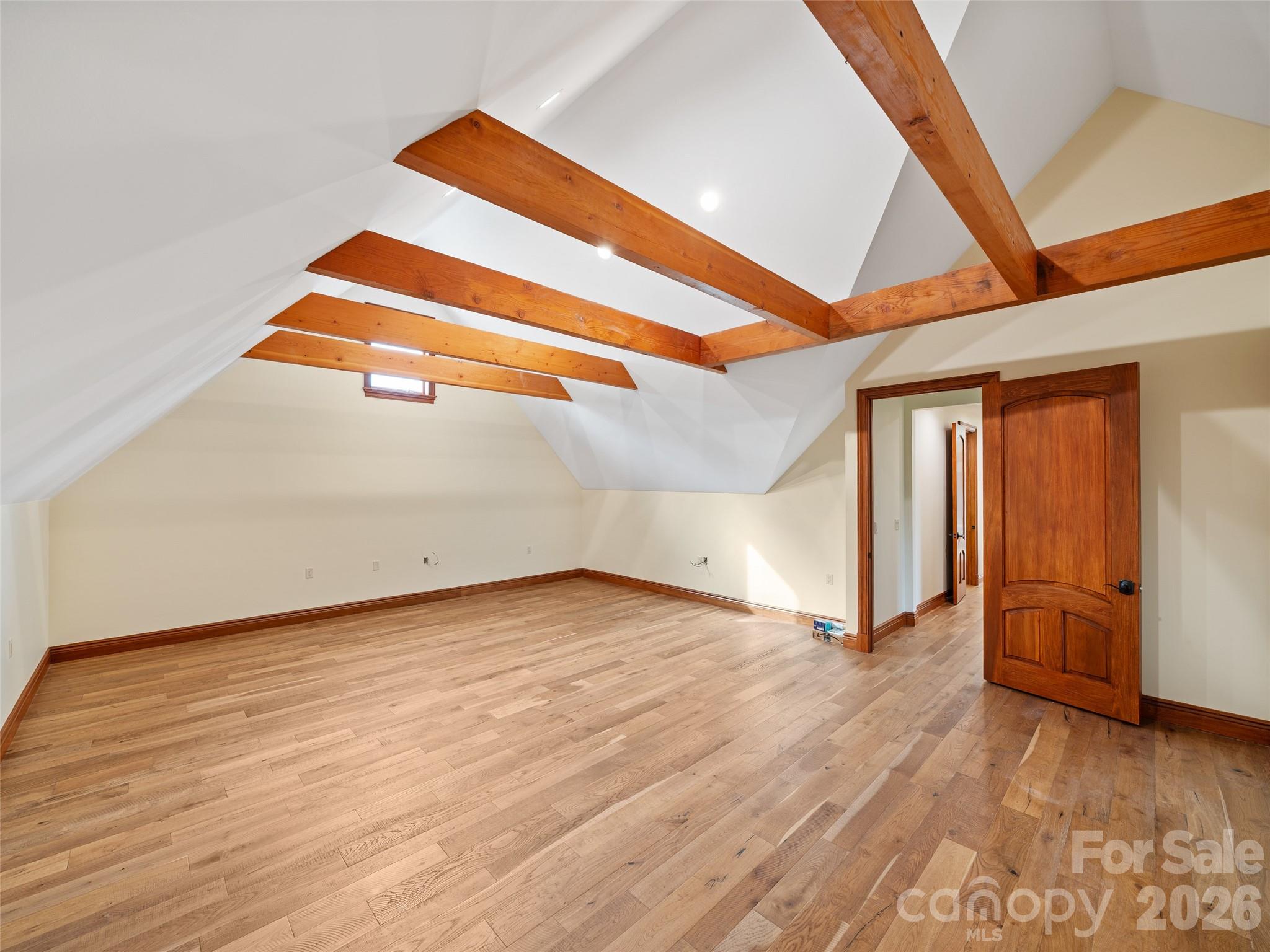946 Ridge Road Green Mountain, NC 28740 - Photo 46 of 48 an empty room with wooden floor and windows