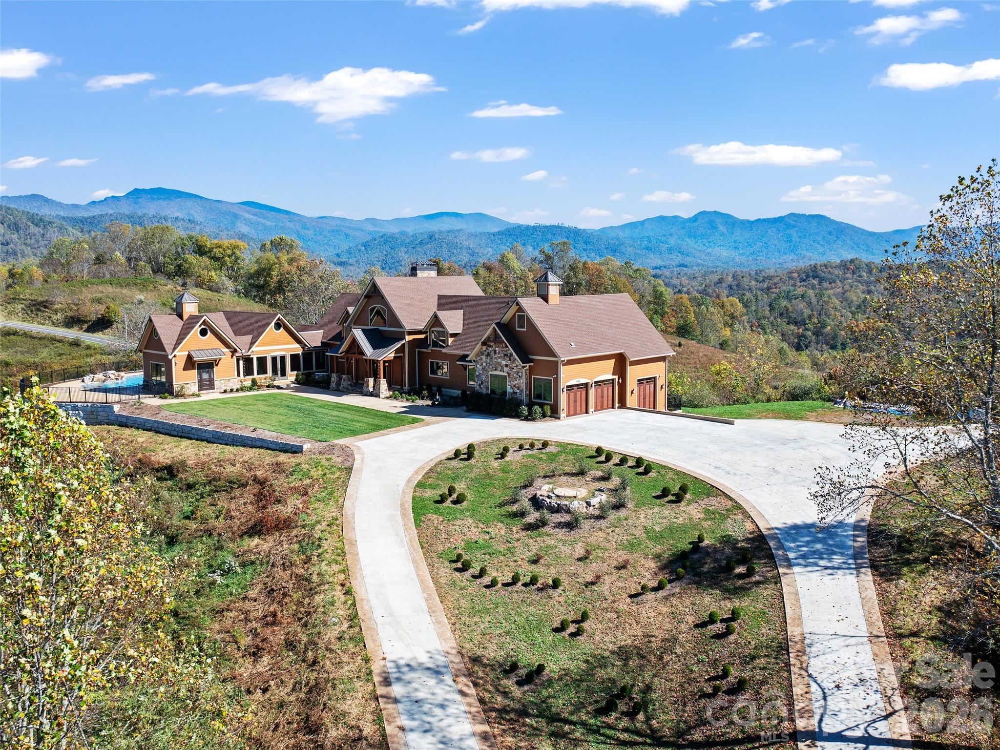 946 Ridge Road Green Mountain, NC 28740 - Photo 9 of 48 an aerial view of a house with a garden