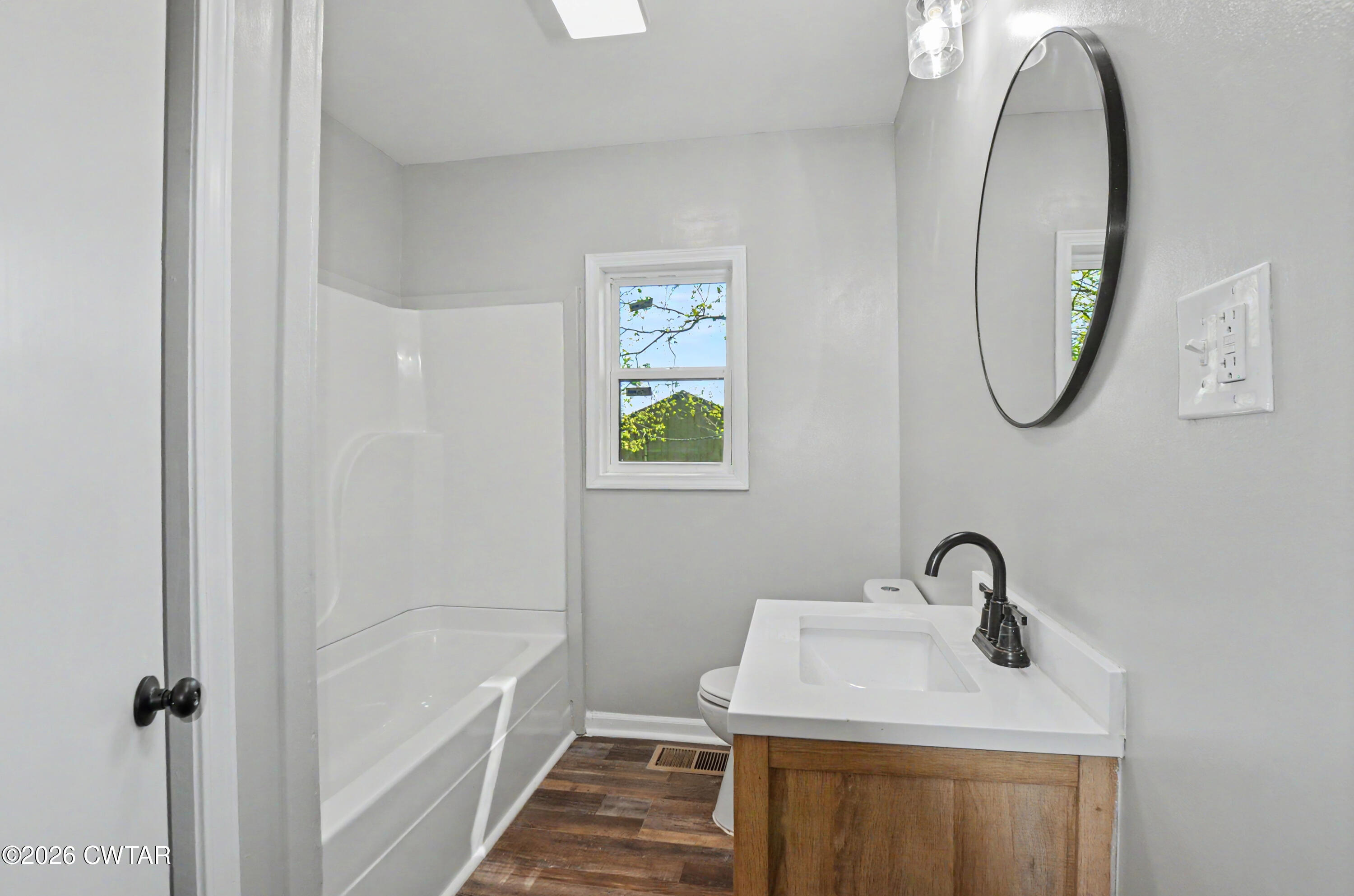 4177 Gum Flat Road Bells, TN 38006 - Photo 24 of 30 a bathroom with a sink toilet and tub
