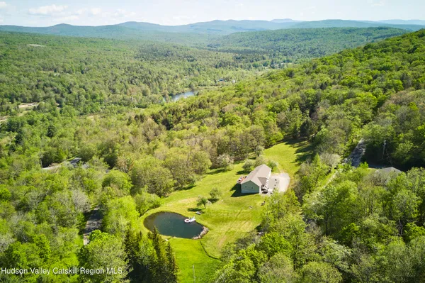 a view of a lake with a yard