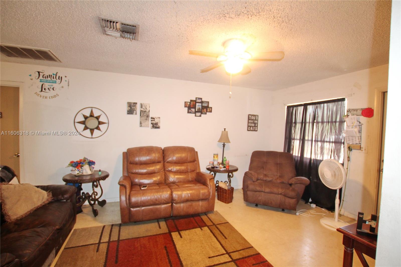 1401 Bassage Road Sebring, FL 33875 - Photo 11 of 18 a living room with furniture and a window