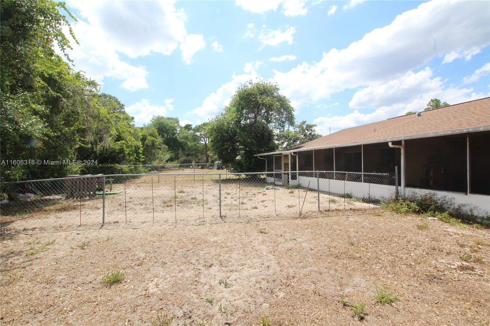1401 Bassage Road Sebring, FL 33875 - Photo 5 of 18 a view of backyard with green space