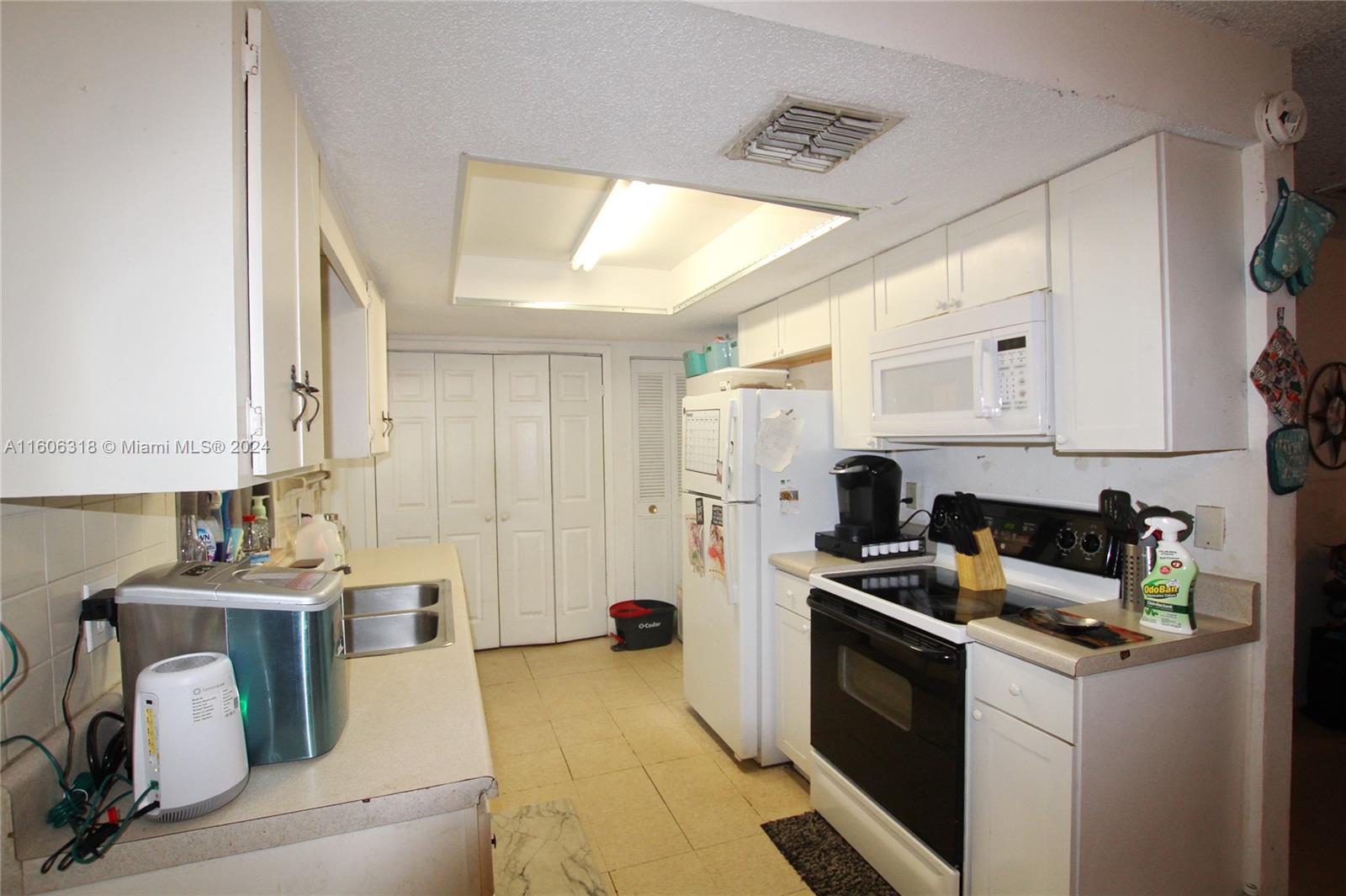 1401 Bassage Road Sebring, FL 33875 - Photo 8 of 18 a kitchen with a sink appliances and cabinets