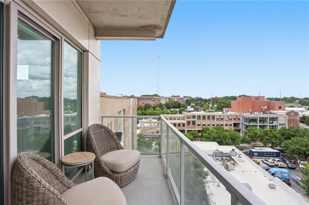 1100 Howell Mill Road Northwest, Unit 608 Atlanta, GA 30318 - Photo 11 of 37 a view of a balcony with furniture