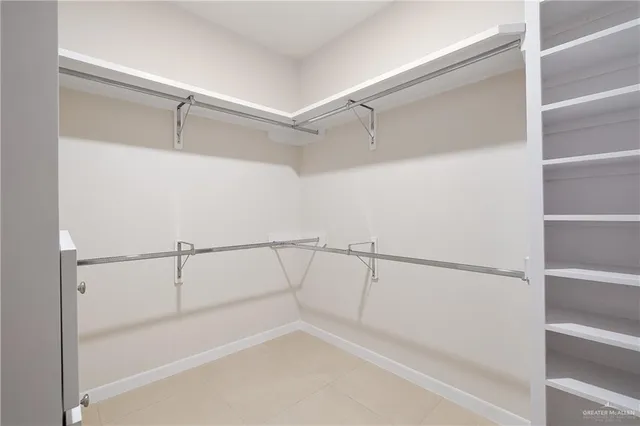 a view of an empty walk in closet