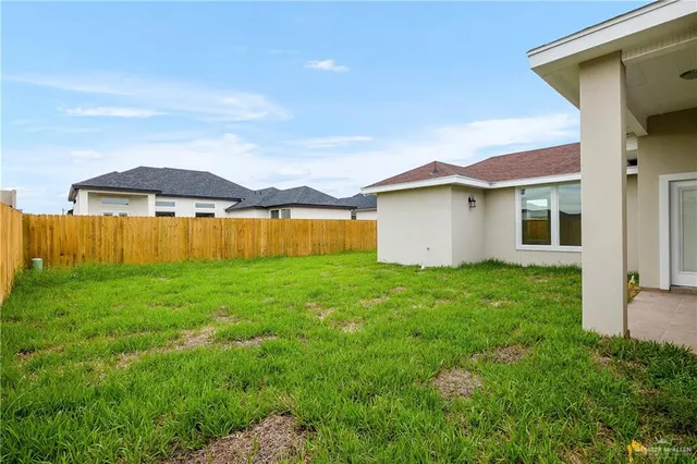 a view of a backyard with a garden and plants