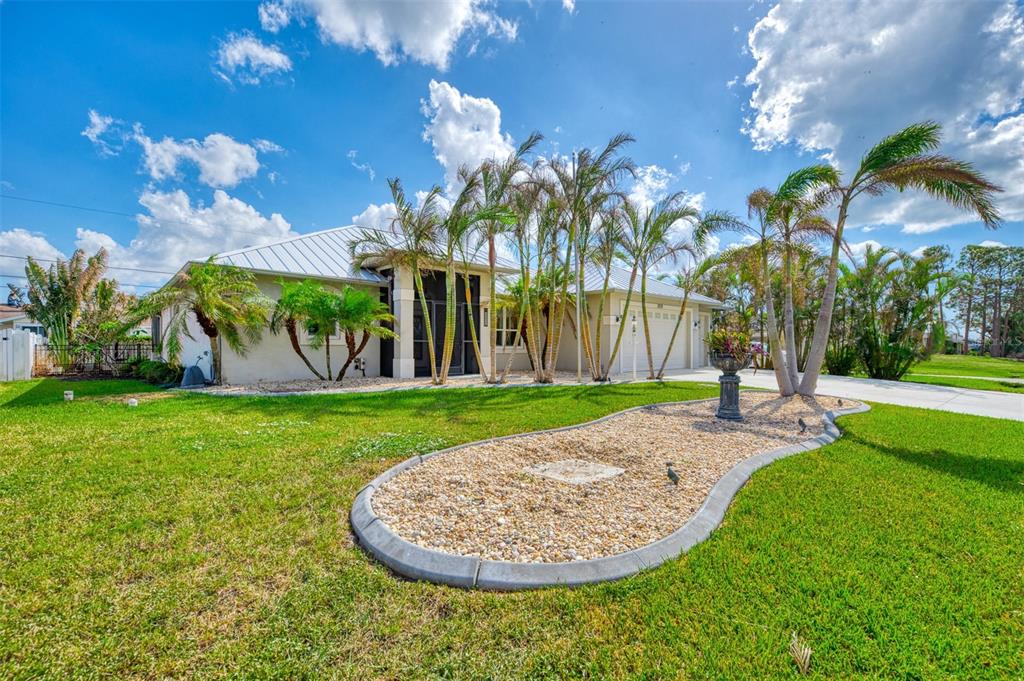 1219 Nantucket Road Venice, FL 34293 - Photo 1 of 1 a view of a swimming pool with a garden