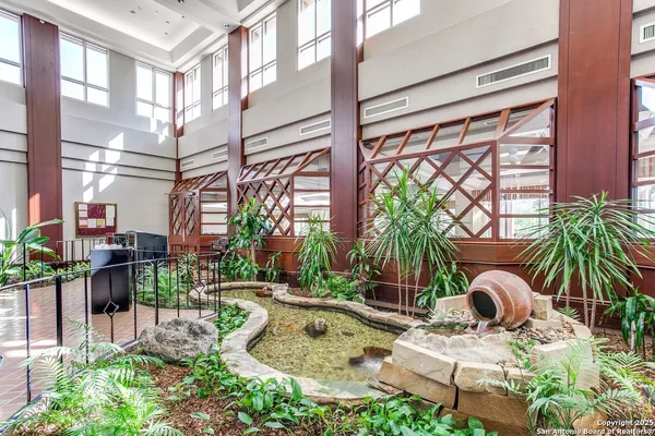 a backyard of a house with barbeque oven table and chairs