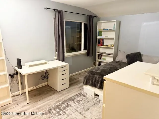 a bedroom with a bed and a cabinets