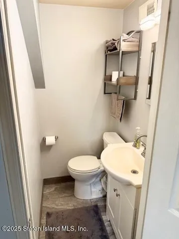 a bathroom with a toilet and a sink