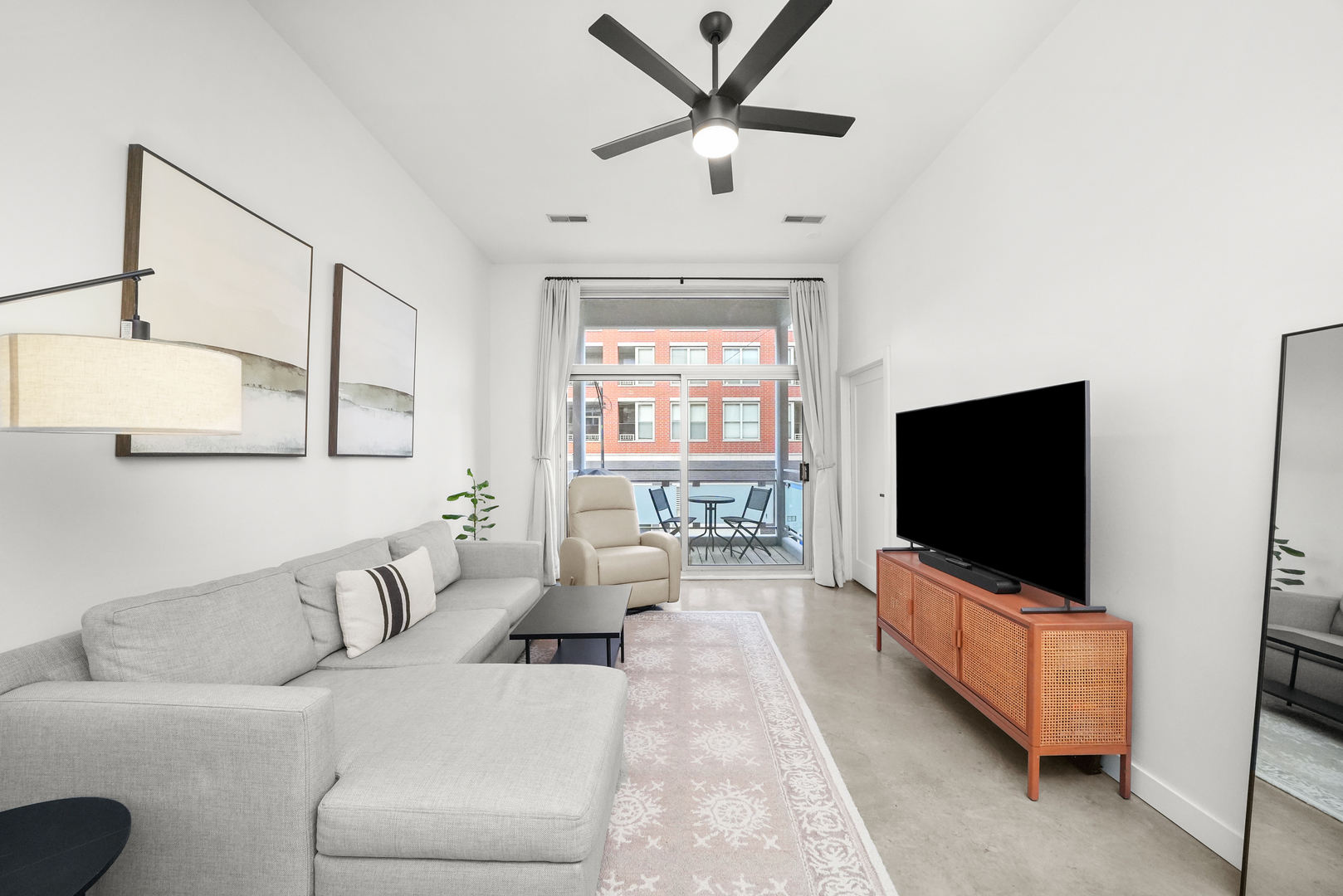 949 West Madison Street, Unit 207 Chicago, IL 60607 - Photo 11 of 31 a living room with furniture and a flat screen tv