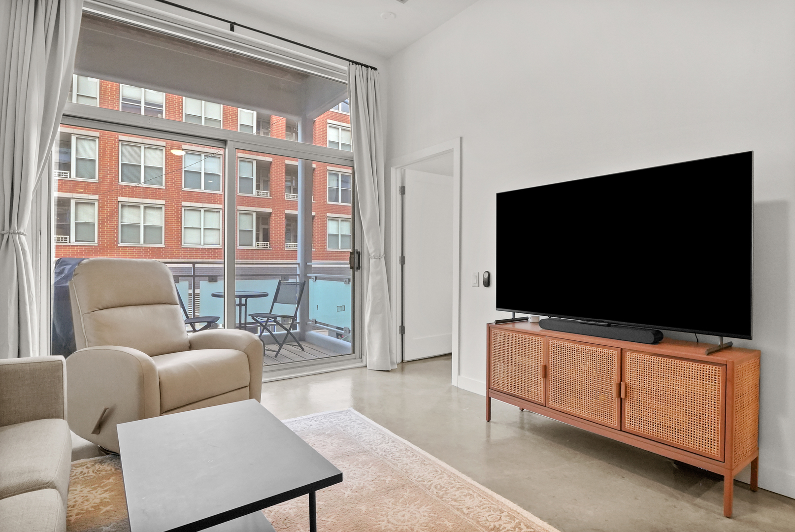 949 West Madison Street, Unit 207 Chicago, IL 60607 - Photo 13 of 31 a living room with furniture and a flat screen tv
