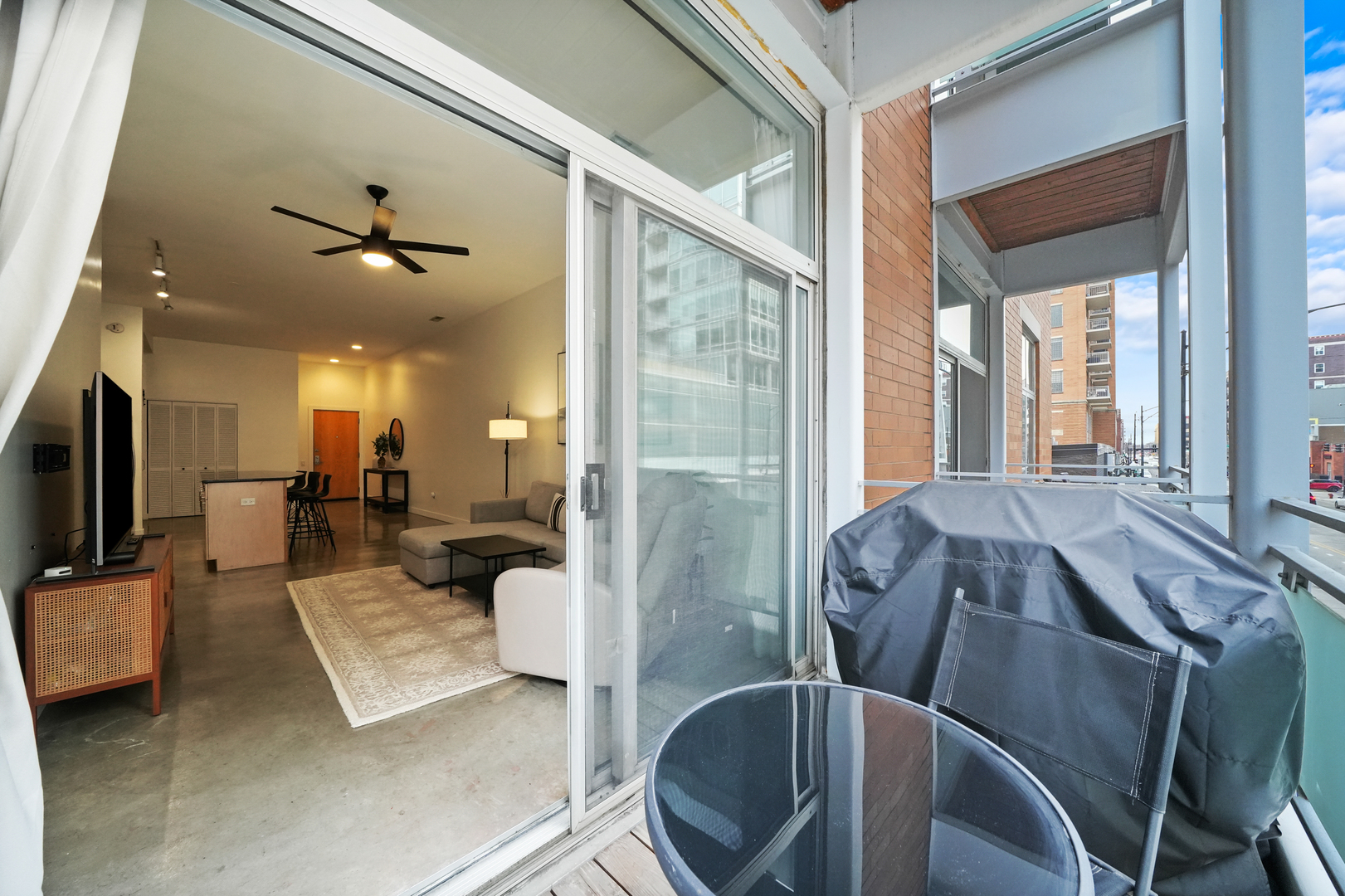 949 West Madison Street, Unit 207 Chicago, IL 60607 - Photo 15 of 31 a view of a balcony with furniture and a potted plant