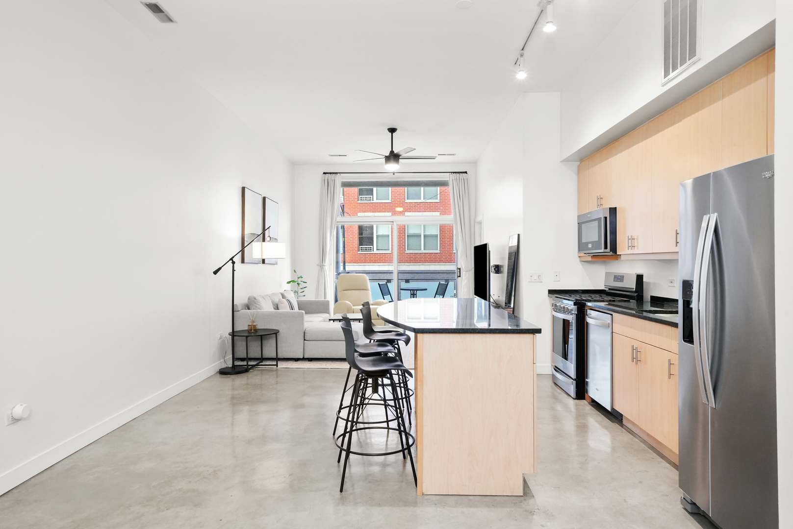 949 West Madison Street, Unit 207 Chicago, IL 60607 - Photo 3 of 31 a kitchen with stainless steel appliances a stove a refrigerator and a refrigerator