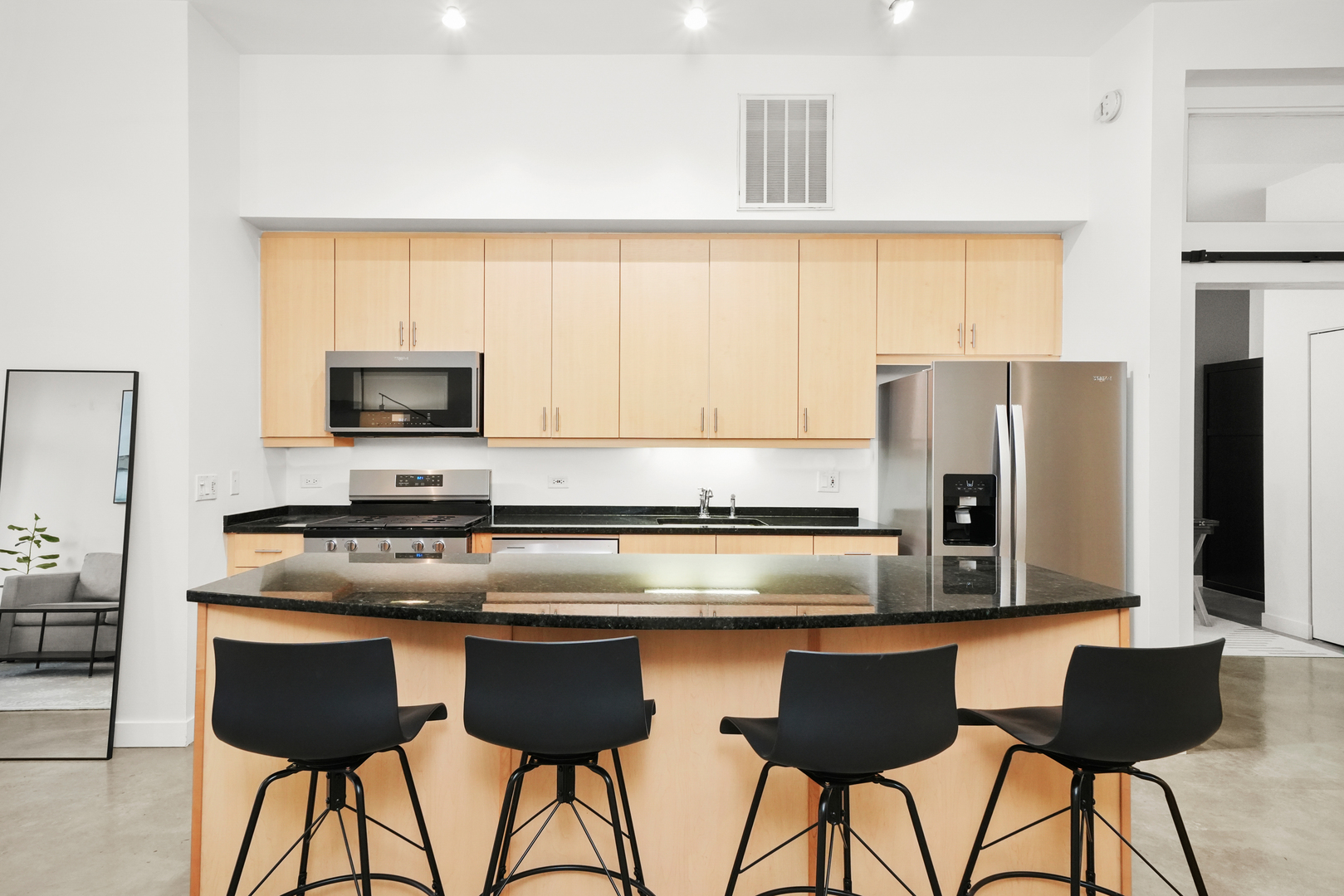 949 West Madison Street, Unit 207 Chicago, IL 60607 - Photo 4 of 31 a kitchen with stainless steel appliances a stove a sink and a refrigerator with wooden floor