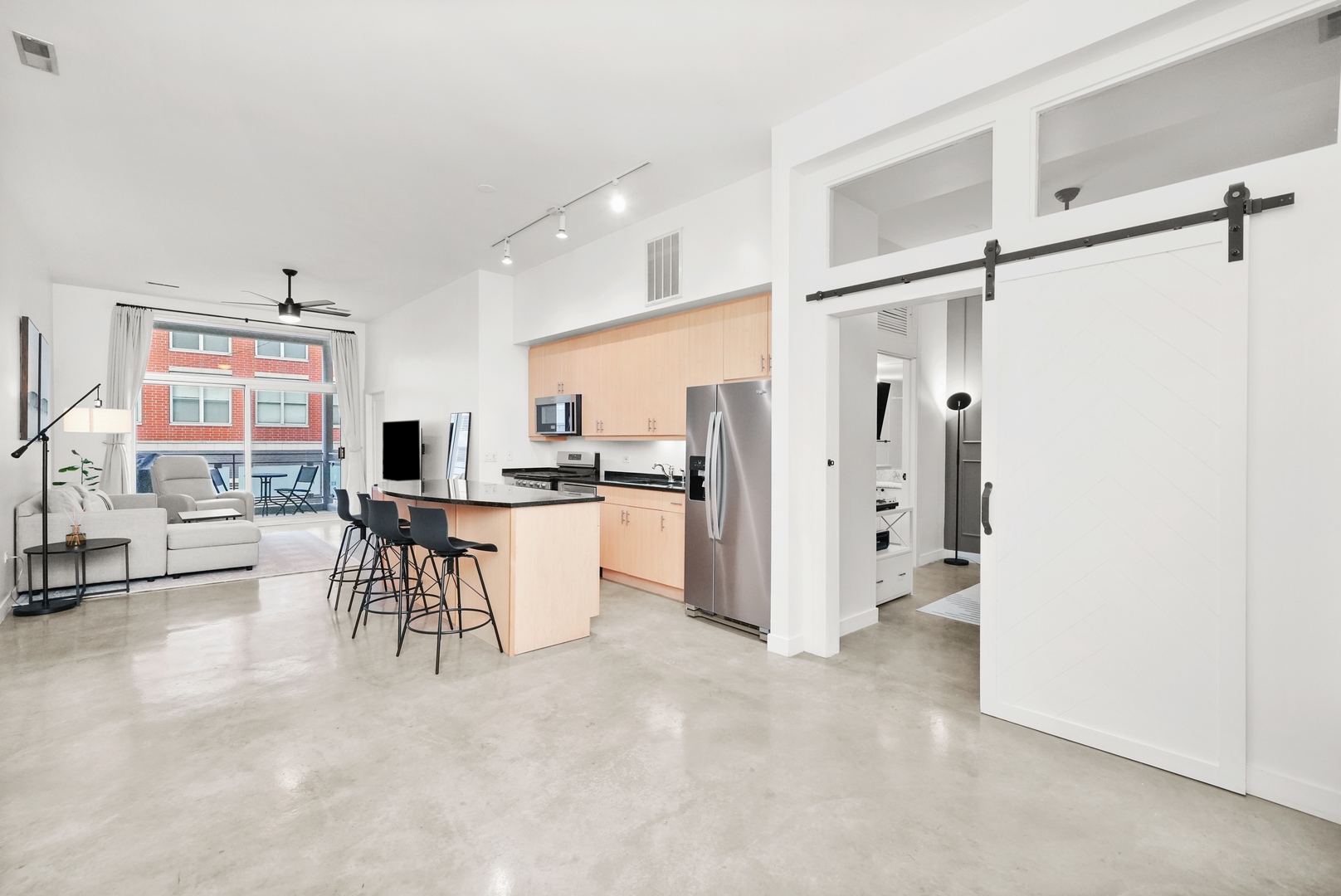 949 West Madison Street, Unit 207 Chicago, IL 60607 - Photo 9 of 31 a view of kitchen with refrigerator and dining table