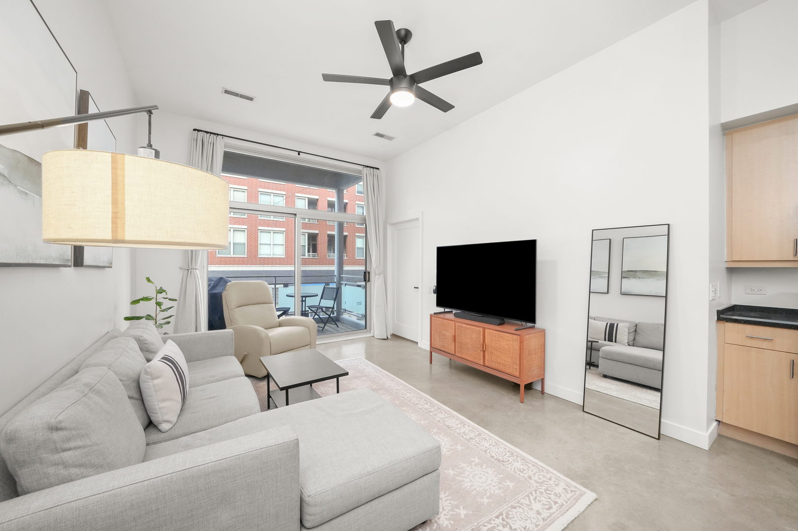 949 West Madison Street, Unit 207 Chicago, IL 60607 - Photo 10 of 31 a living room with furniture and a flat screen tv