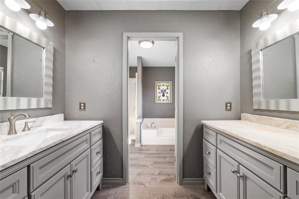 13601 Highway 377 Brookesmith, TX 76827 - Photo 14 of 35 a bathroom with a sink a vanity and a mirror