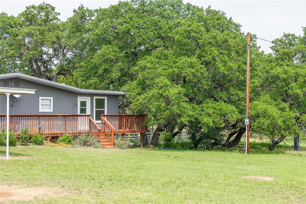 13601 Highway 377 Brookesmith, TX 76827 - Photo 3 of 35 a view of a house with a backyard